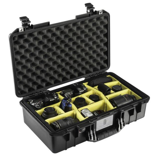 A black Pelican 1525 Air Camera Case open with camera equipment positioned in the padded divider slots.