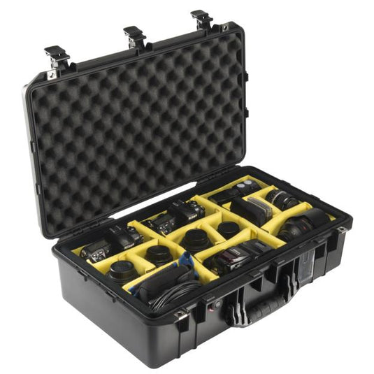 A black Pelican 1555 Air Camera Case open with camera equipment positioned in the padded divider slots.