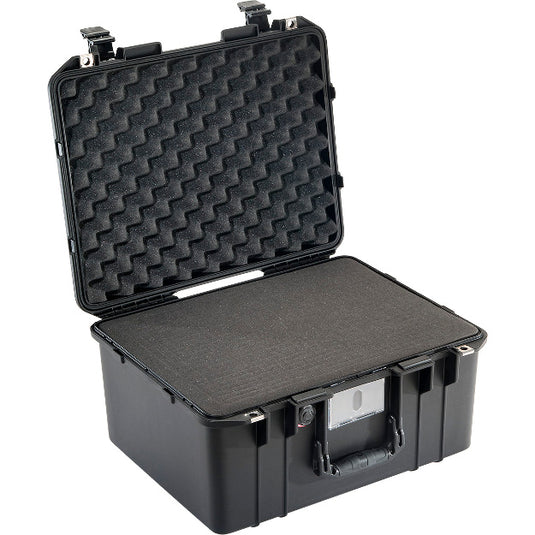 A black Pelican 1557 Air Case with its lid open, showing the foam interior.