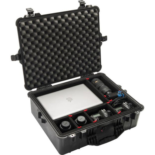 A black Pelican 1600 TrekPak case open with equipment placed in the interior divider slots. There is a laptop and camera equipment inside the case.