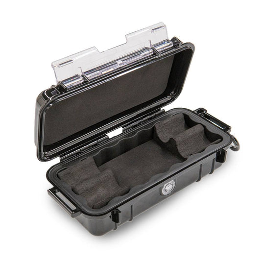 A black Pelican 1030 micro case open, showing in detail the custom cut foam.