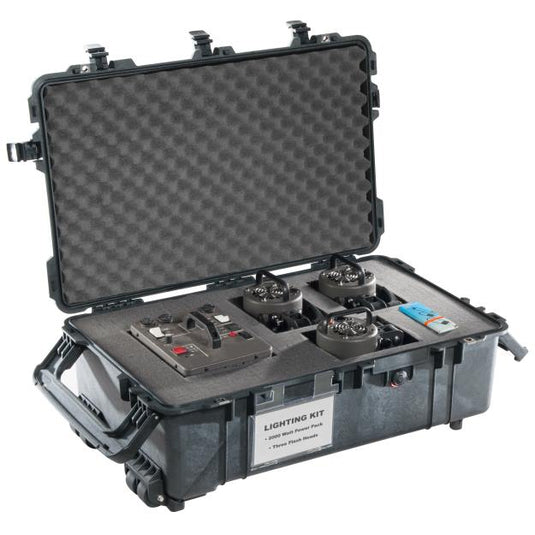 A black Pelican 1670 Transport Case  open with cut foam inside. Equipment is placed inside the foam cutouts.