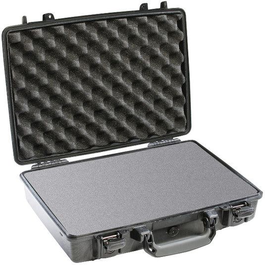A black Pelican 1470 laptop case open, showing the foam interior.
