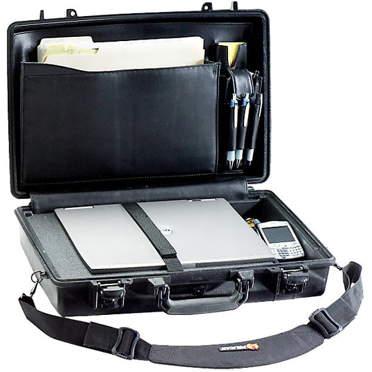 A black Pelican 1490CC1 laptop case is open and organized, showing compartments for storage. A computer sits on foam with a strap securing it. In the lid, pens and folders are separated in a lid organizer. A shoulder strap sits outside of the case.