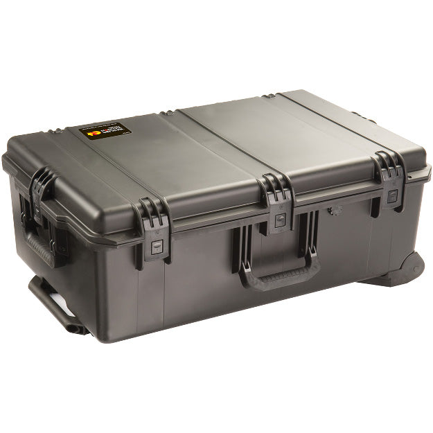 Load image into Gallery viewer, A black iM2950 Storm Case closed, showing its exterior handles, latches, and wheels.
