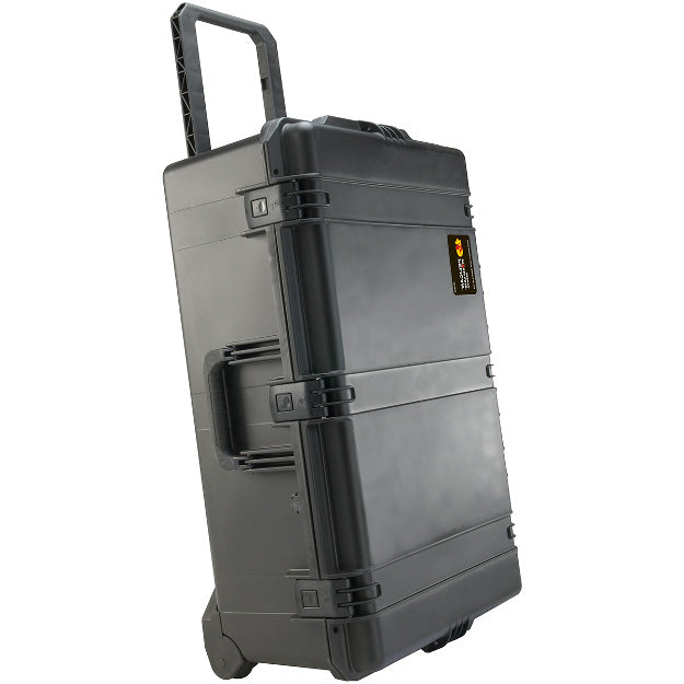Load image into Gallery viewer, A black iM2950 Storm Case standing upright with its top handle pulled out, showing how it can be moved on its wheels.

