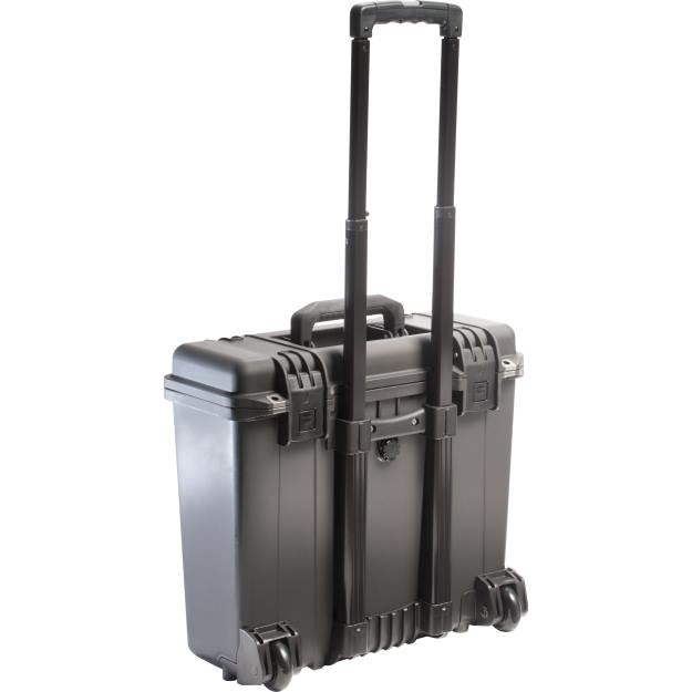Load image into Gallery viewer, A black iM2435 Storm carry-on case with its pull handle fully extended, showing how it can be moved on its wheels.
