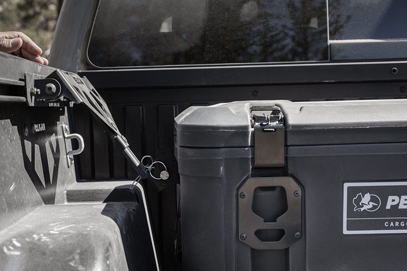 Load image into Gallery viewer, A black Pelican Cargo BX135 case that is mounted to the interior of a truck bed.
